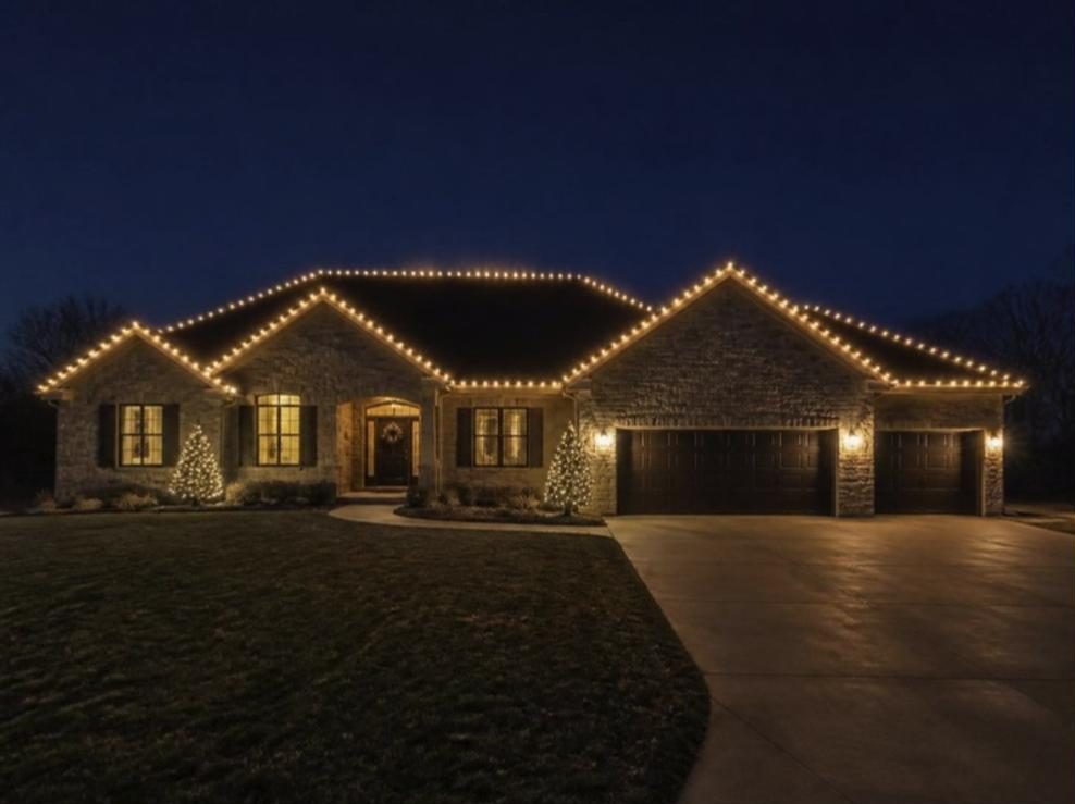 Example mockup: a stone ranch home with its roofline outlined in warm white lights